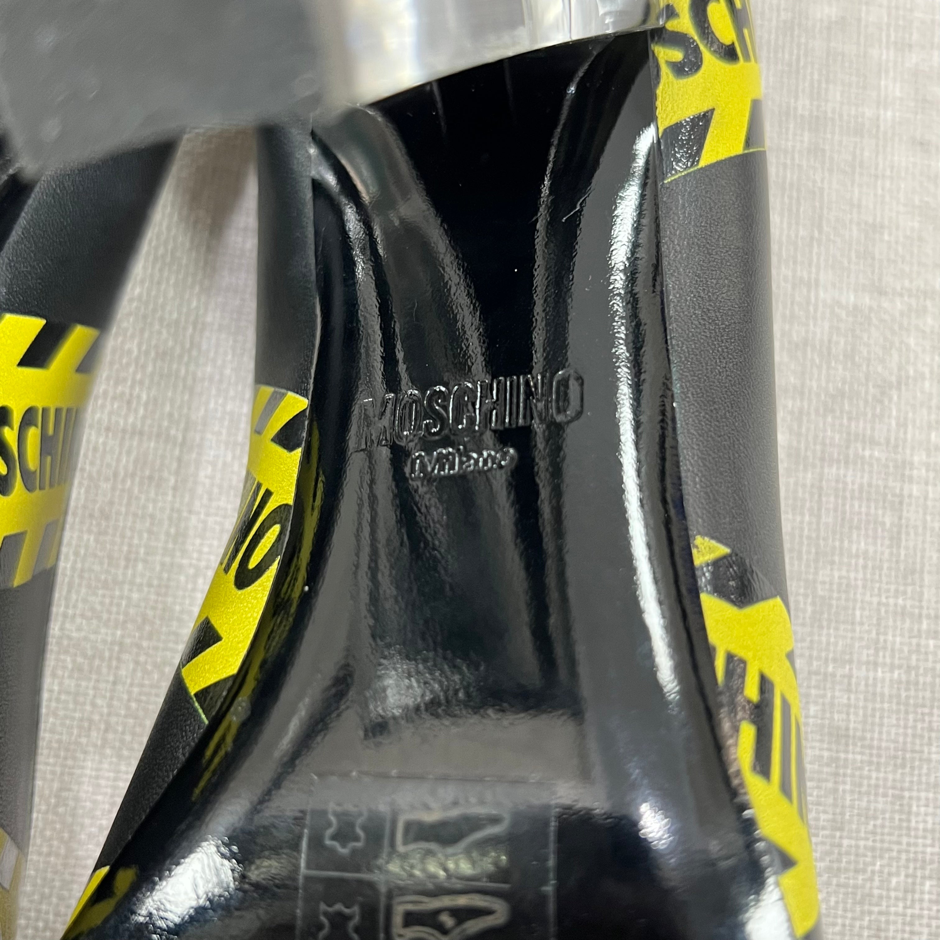 MOSCHINO CAUTION PRINTED LEATHER PUMPS