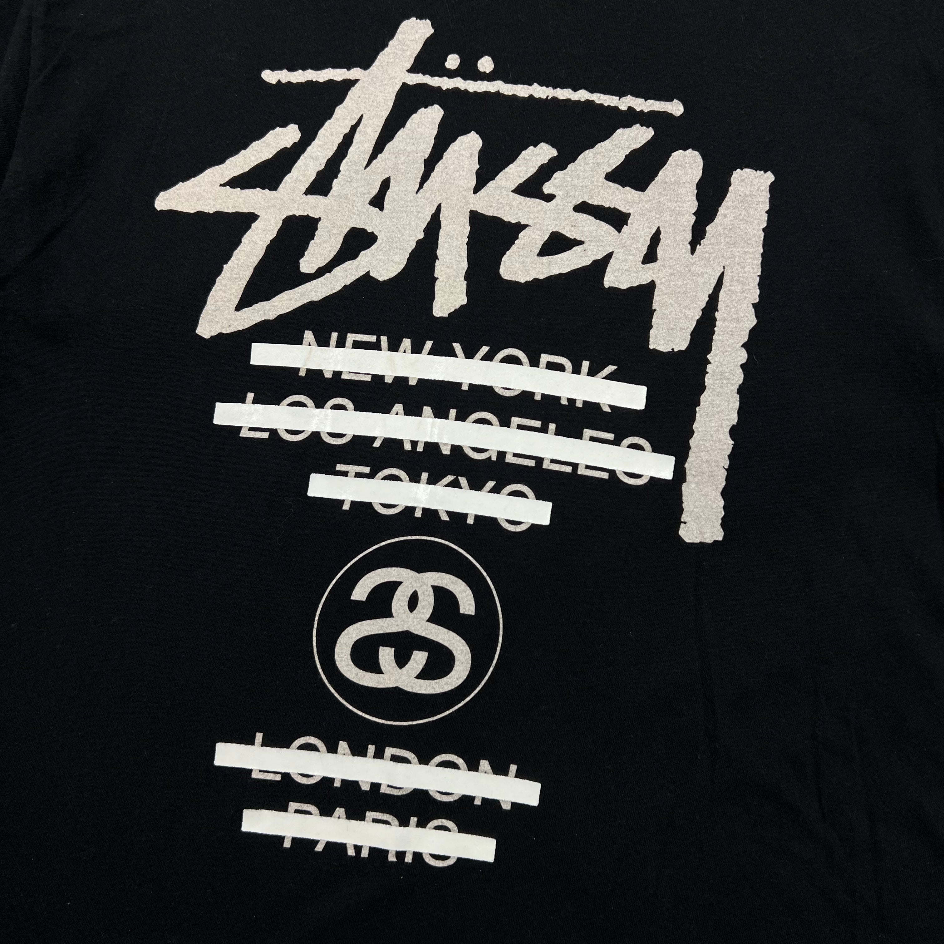 STUSSY WORLD TOUR TEE CROSSED-OUT CITY NAMES