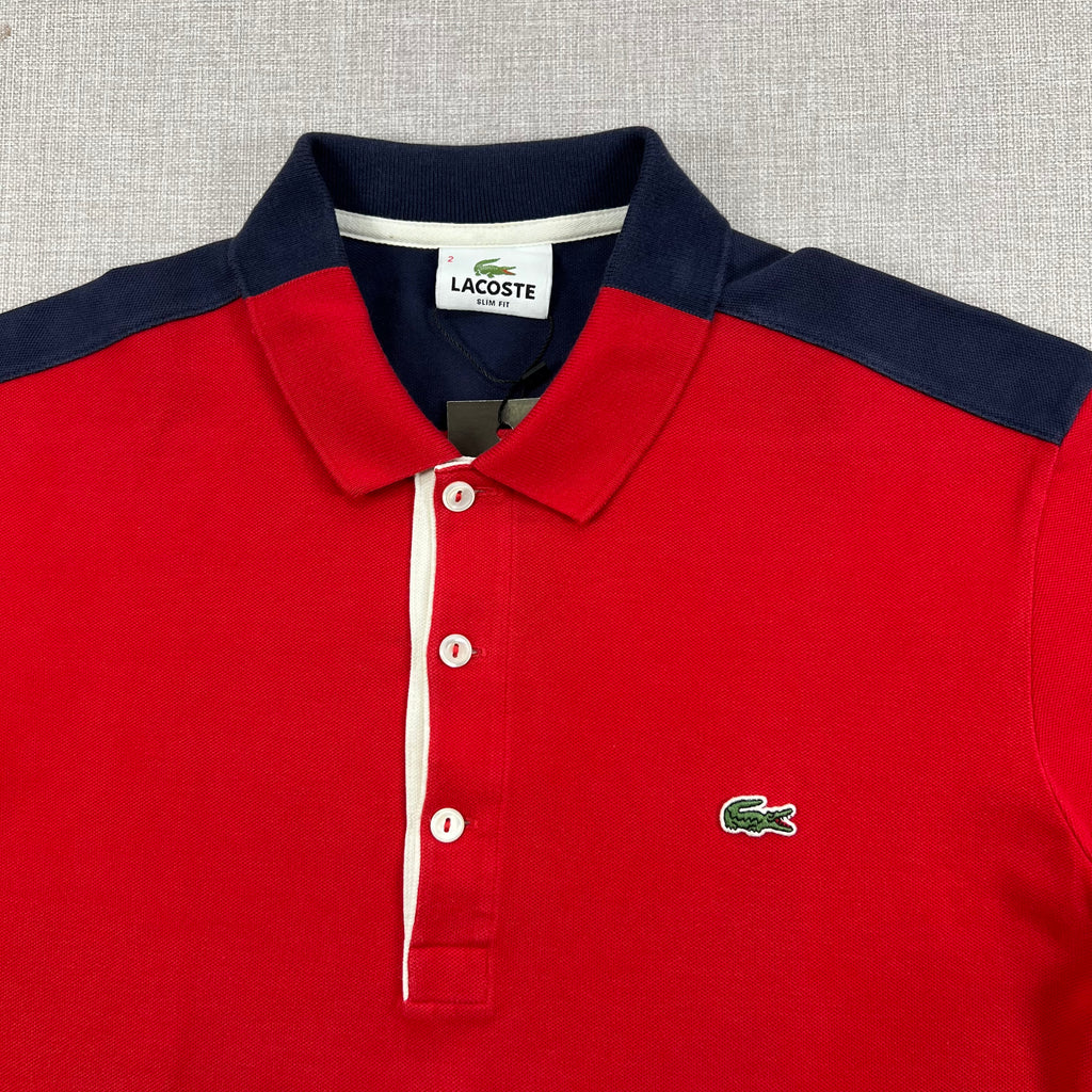 LACOSTE P/S WITH CONTRASTING NAVY BLUE SHOULDER PANELS