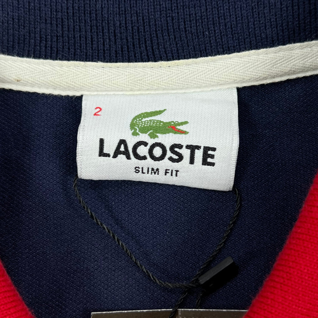 LACOSTE P/S WITH CONTRASTING NAVY BLUE SHOULDER PANELS