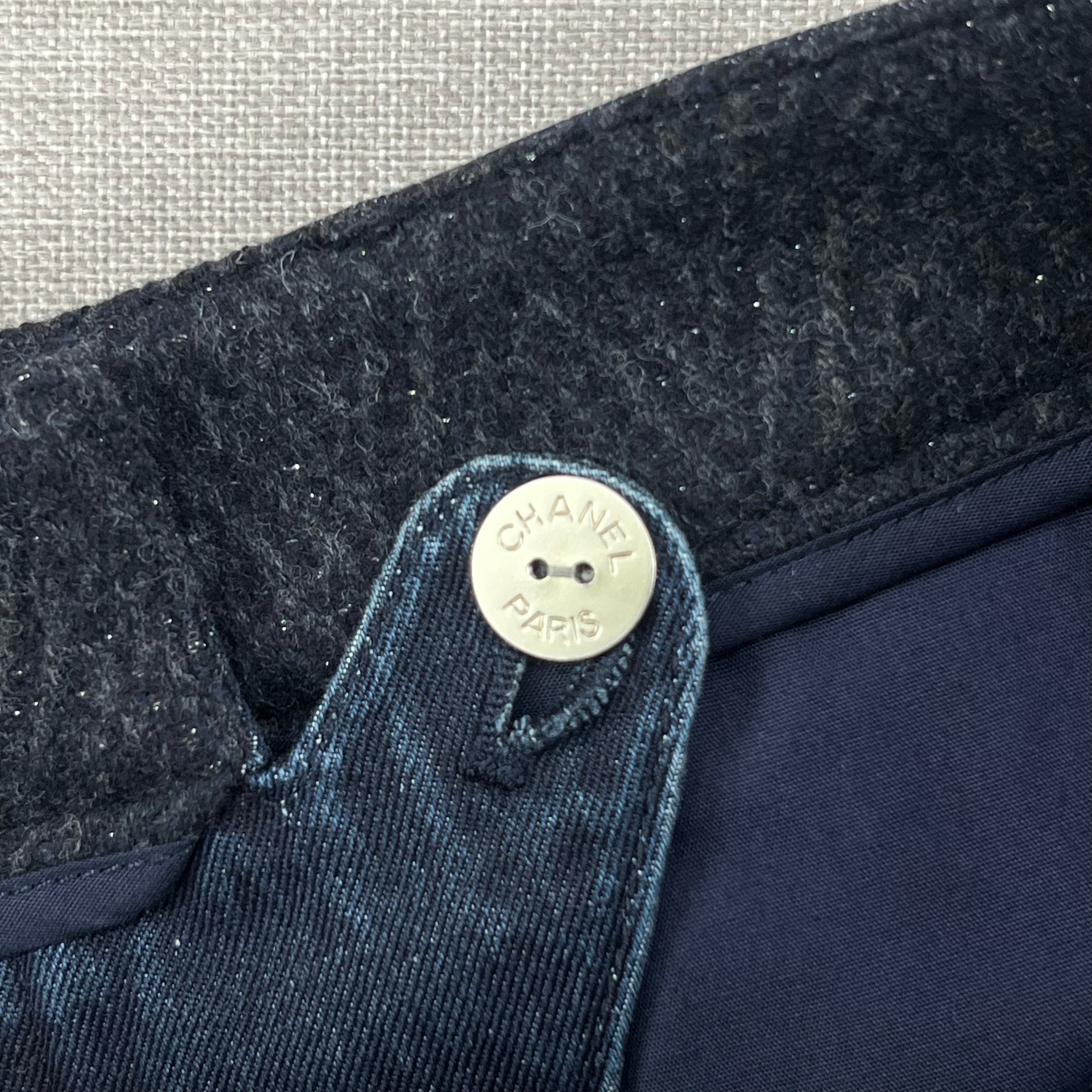 CHANEL DENIM SHORT FEATURE A SIGNATURE COCOMARK BUTTON